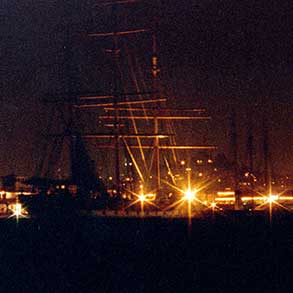 Some friends lighting a cigarette on the dock of the Bay in San Francisco