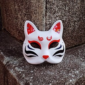 Cat mask against a concrete background