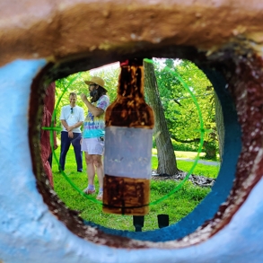 2 men talking through an eye