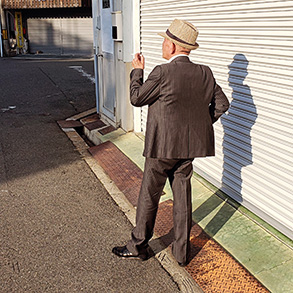 A man smoking a cigarette in Osaka