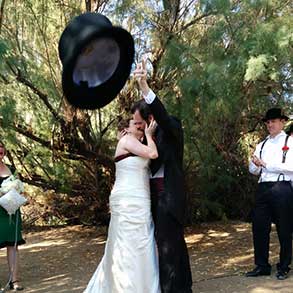 Sometimes you get that perfect shot like this one as the groom throws his hat into the audience